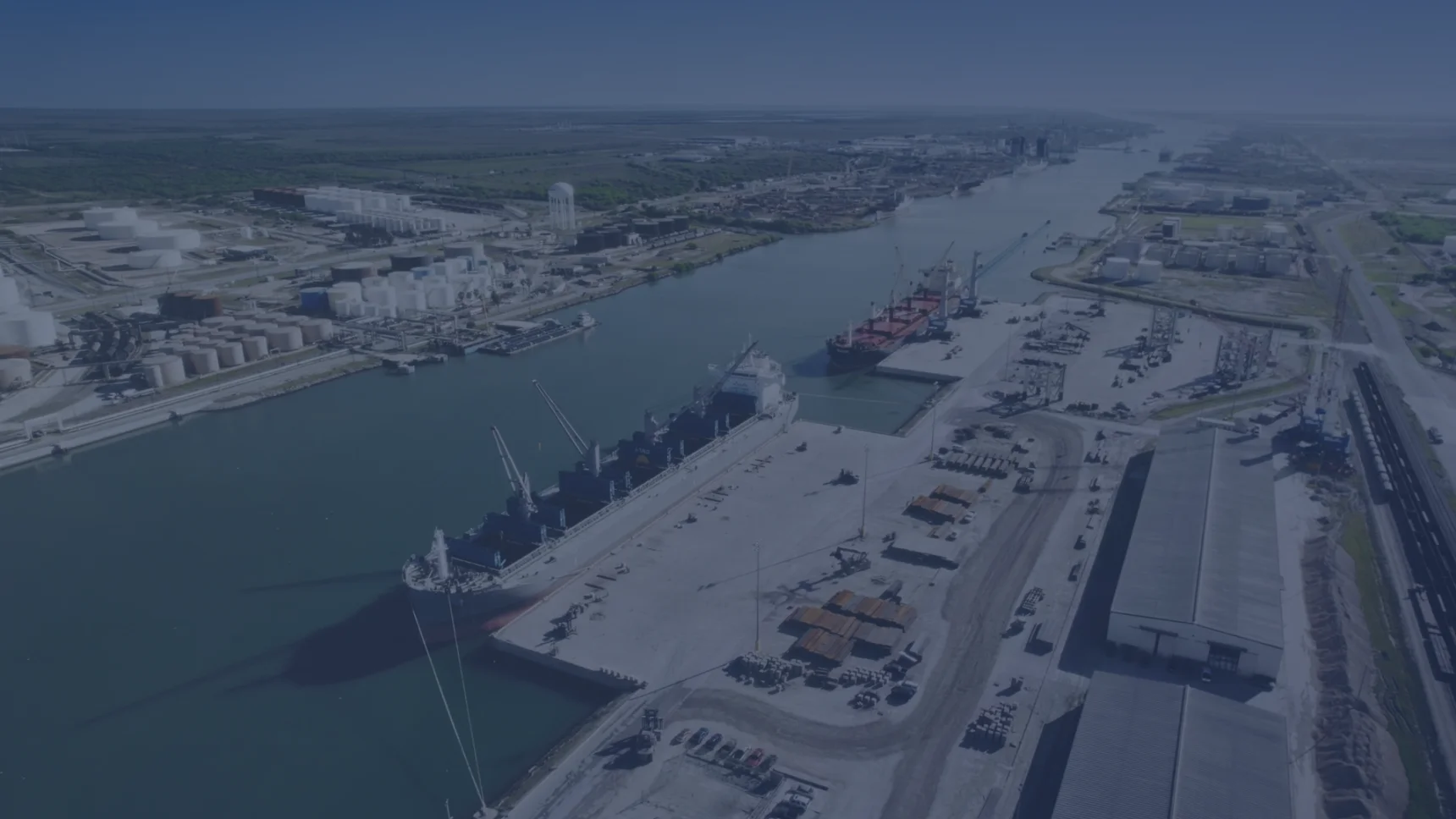 Aerial photograph of ships, cargo docks and industrial infrastructure at the Port of Brownsville